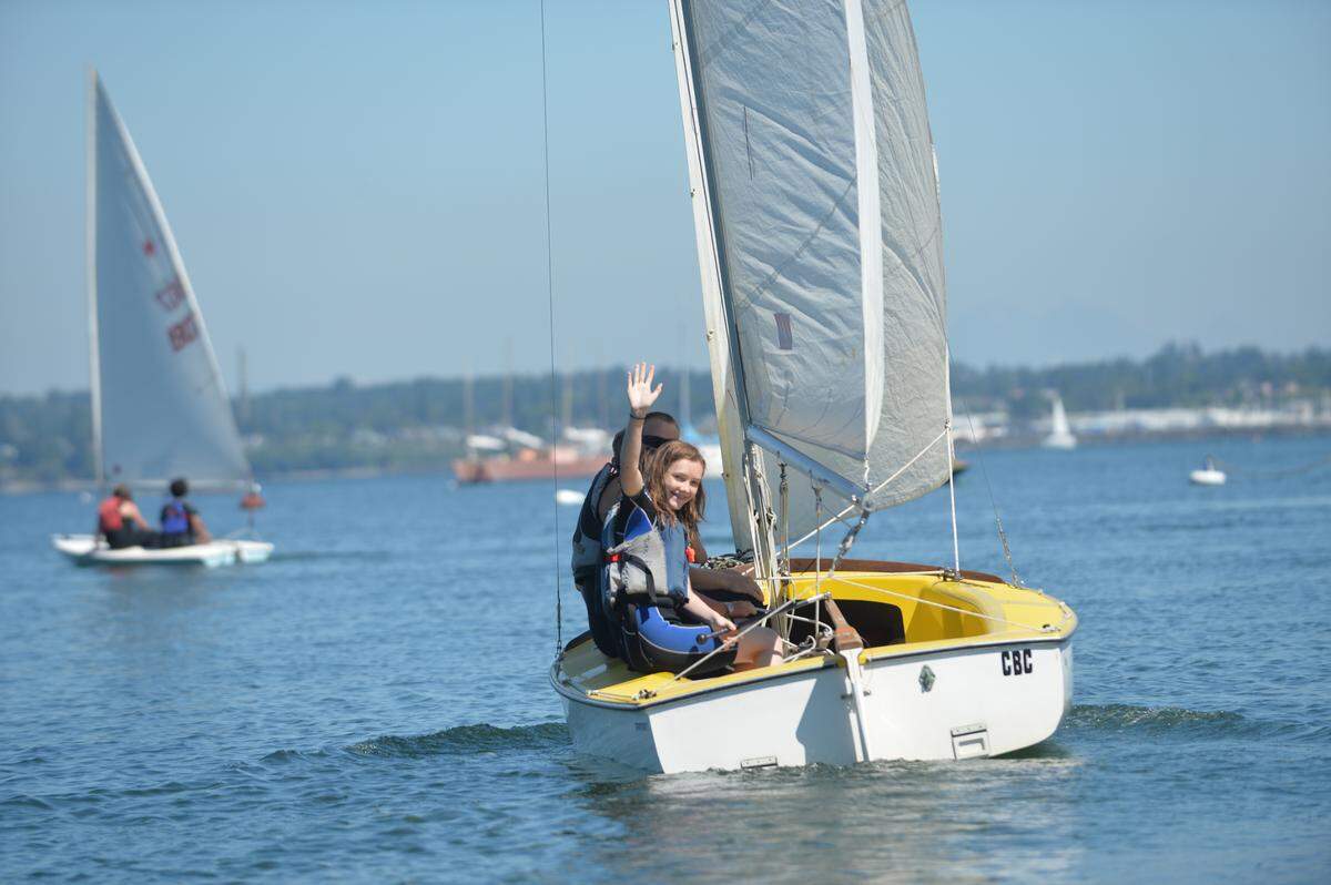 Kids sail on the first day of the 2014 Community Boating Center Adventure Sailing Camp on Bellingham Bay.