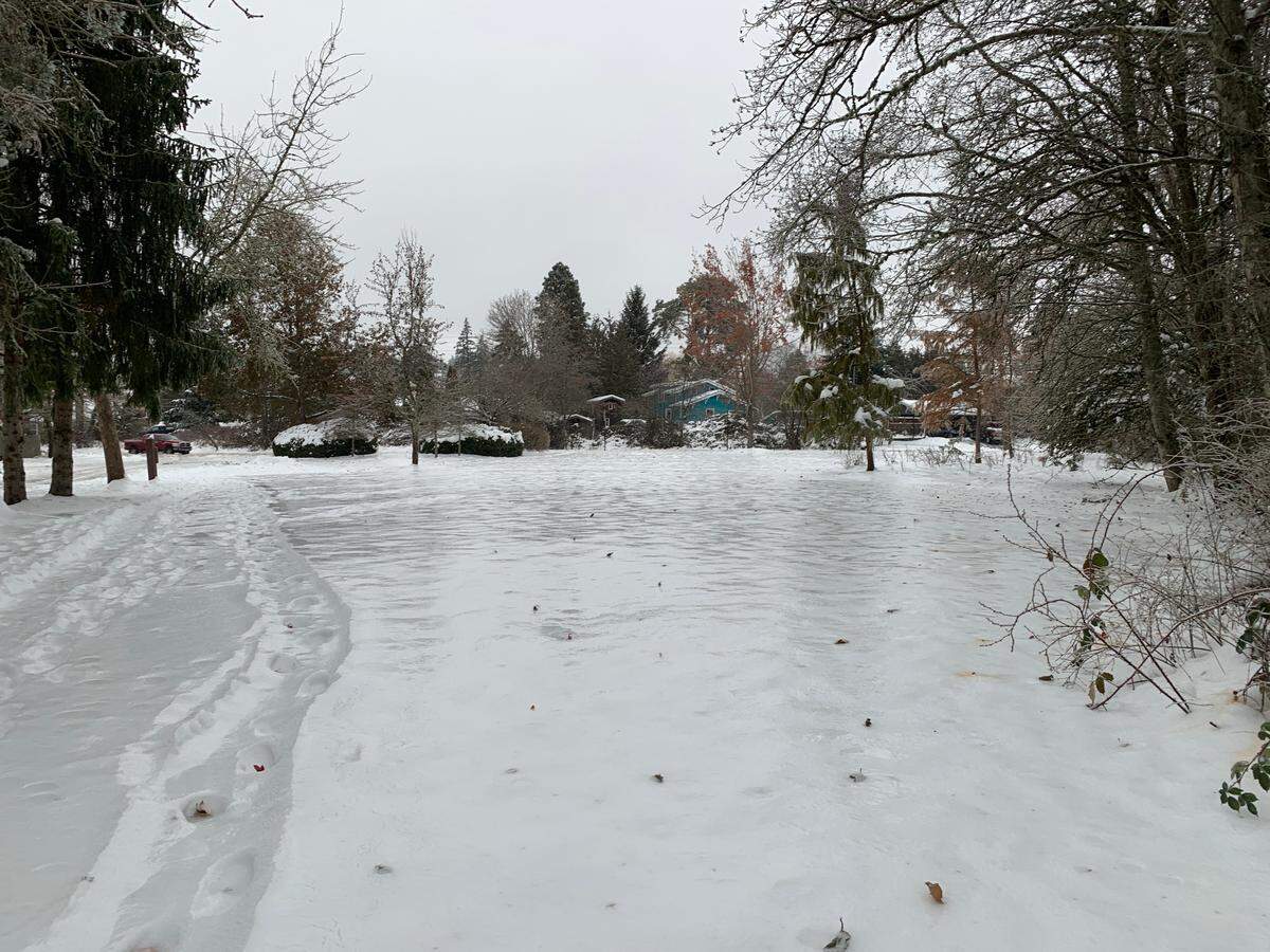 Ice coats a snow-covered field off 16th Street looking at Old Fairhaven Parkway Friday, Dec. 23, in Bellingham.