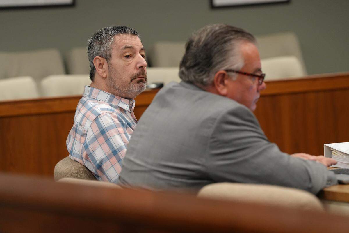 Joel Berck Young, 63, of Maple Falls, in court with one of his defense attorneys, Starck Follis, on Sept. 11, the first day of his jury trial.