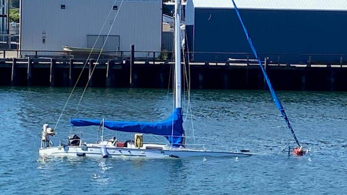 A 36-foot sailboat sinks Monday, July 25, in the Whatcom Creek Waterway near the Granary Building in Bellingham.