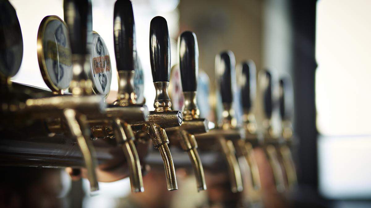 Close-up of beer taps at microbrewery.