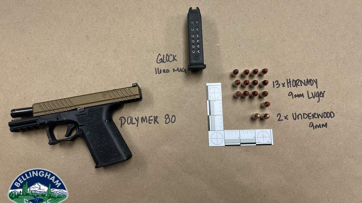 Bellingham Police supplied this photo of the pistol that was taken from a 17-year-old boy at a high school graduation ceremony in Bellingham, Wash., on Saturday, June 10, 2023. The gun was a 9mm Polymer 80 semiautomatic pistol, with a 16-round magazine and 15 rounds of 9mm ammunition.
