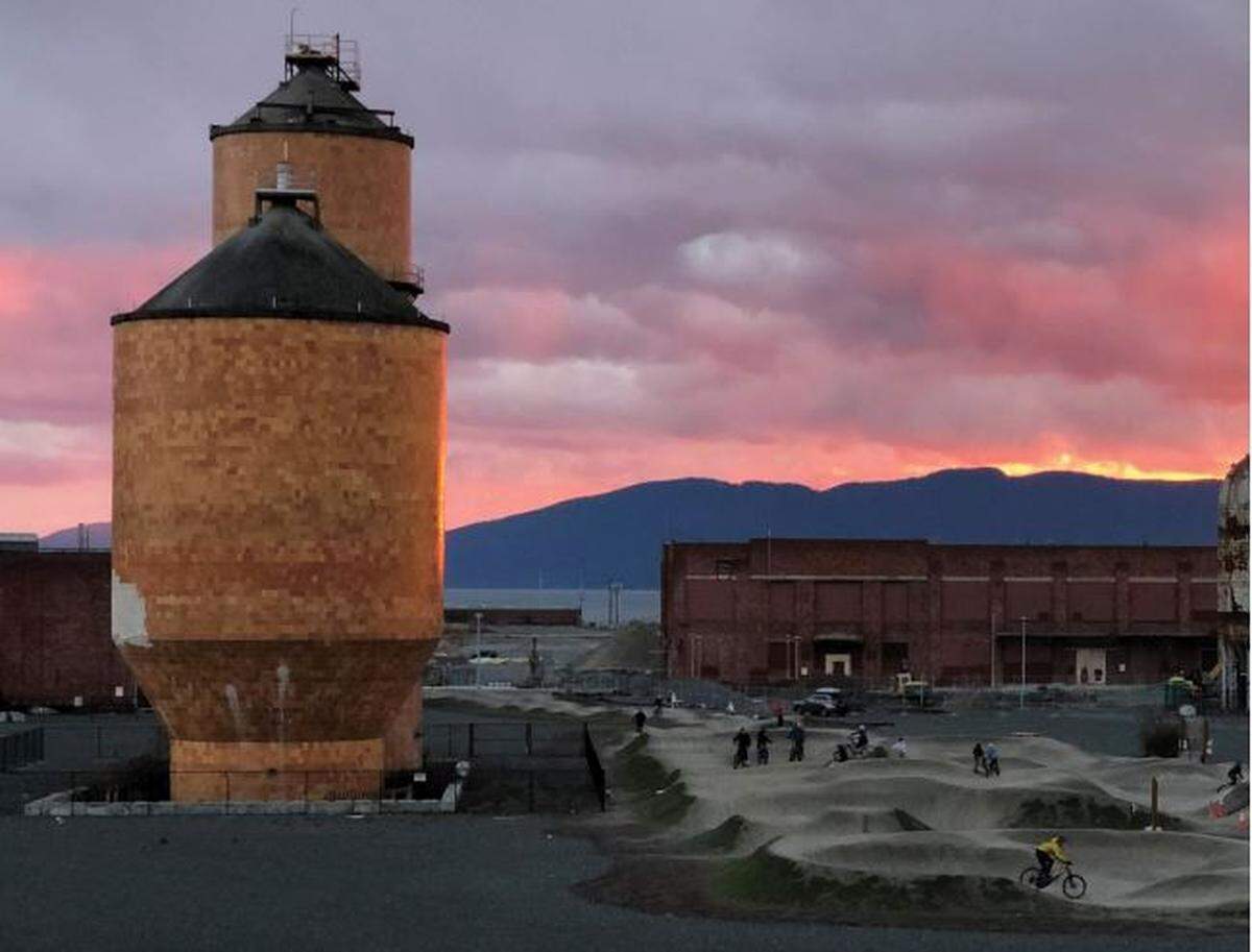 Ceramic tile tanks remaining from the Georgia-Pacific tissue mill stand next to the Port of Bellingham’s pump track on the waterfront.