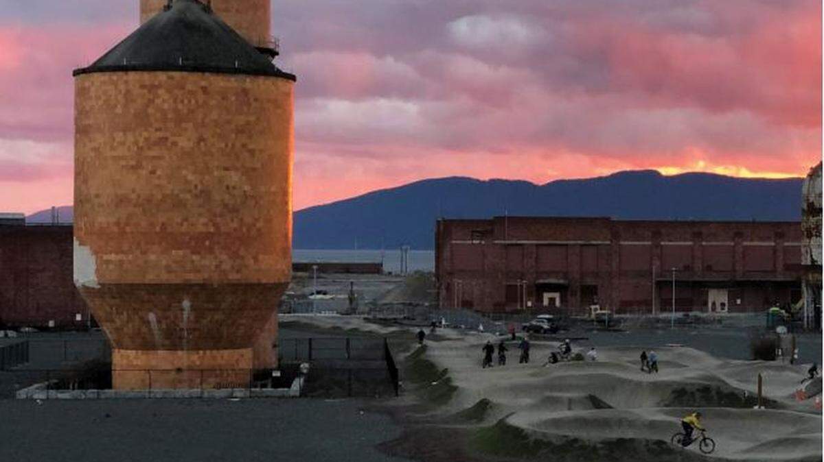 Ceramic tile tanks remaining from the Georgia-Pacific tissue mill stand next to the Port of Bellingham’s pump track on the waterfront.