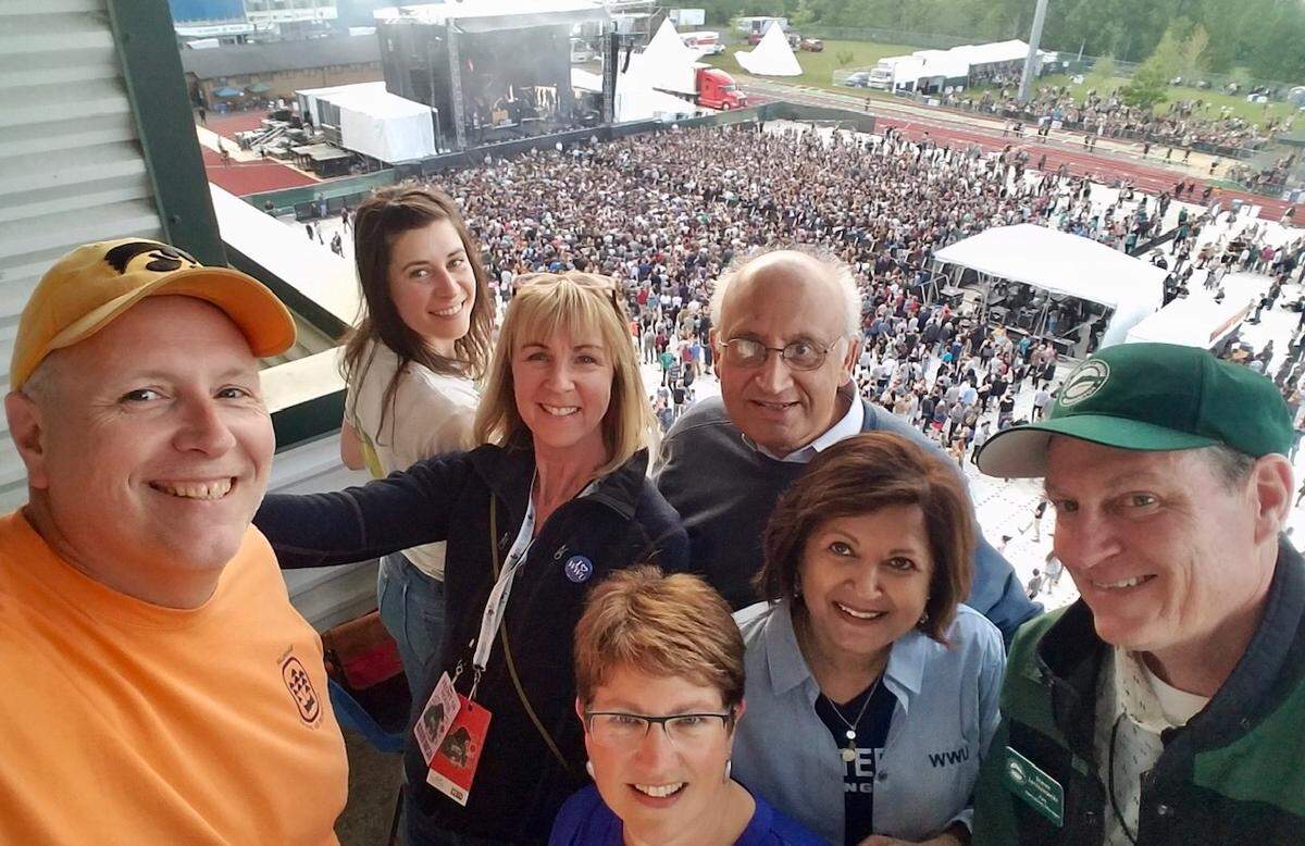 Concert goers, from left, Bellingham Parks and Recreation’s Mike Love, Rachel Demy (the wife of Death Cab for Cutie’s Ben Gibbard), WWU Alumni Association’s Deborah DeWees, WWU Vice President of University Advancement Stephanie Bowers, WWU President Sabah Randhawa, Uzma Randhawa, and Bellingham Parks and Recreation’s Steve Janiszewski enjoy the Double Major event from the crows nest at Civic Stadium May 18 in Bellingham.