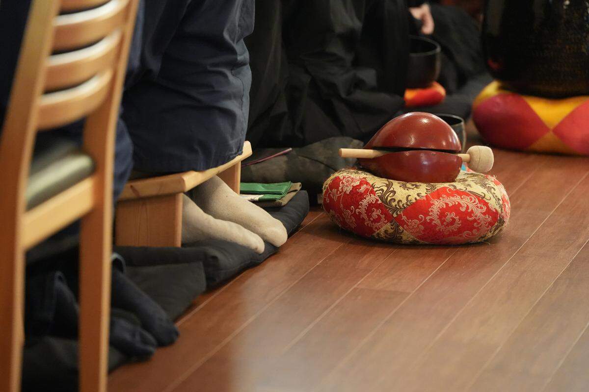 Red Cedar Zen Community members participate in silent meditation at the newly renovated Buddhist Temple on Cedarwood Avenue.