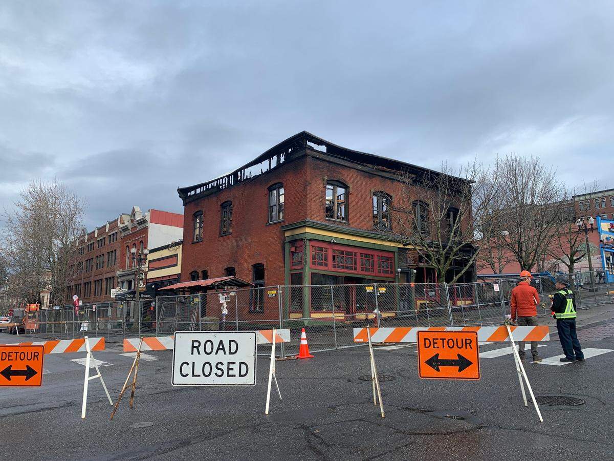 Crews investigate the Harris Avenue scene of the fire that destroyed the historic Fairhaven Terminal Building in 2023