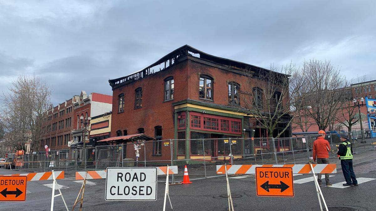 Harris Avenue was closed to vehicle traffic between 11th and 12th Streets Tuesday, Dec. 19, 2023, as crews continued investigating the fire that destroyed the historic Fairhaven Terminal Building on Sunday, Dec. 17, in Bellingham, Wash.