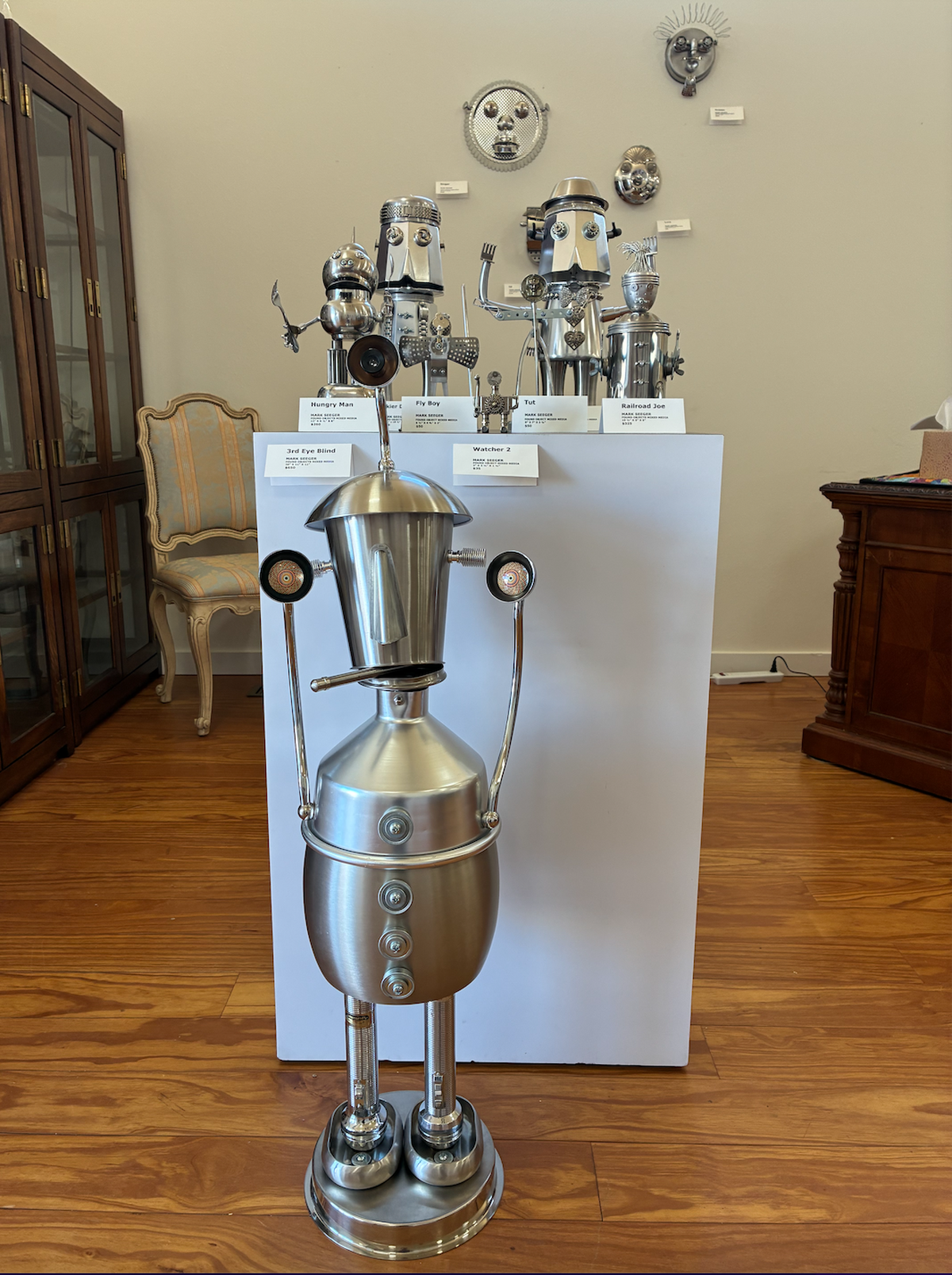 Robots made from household items stand on display at the It’s About Time art gallery in Ferndale.