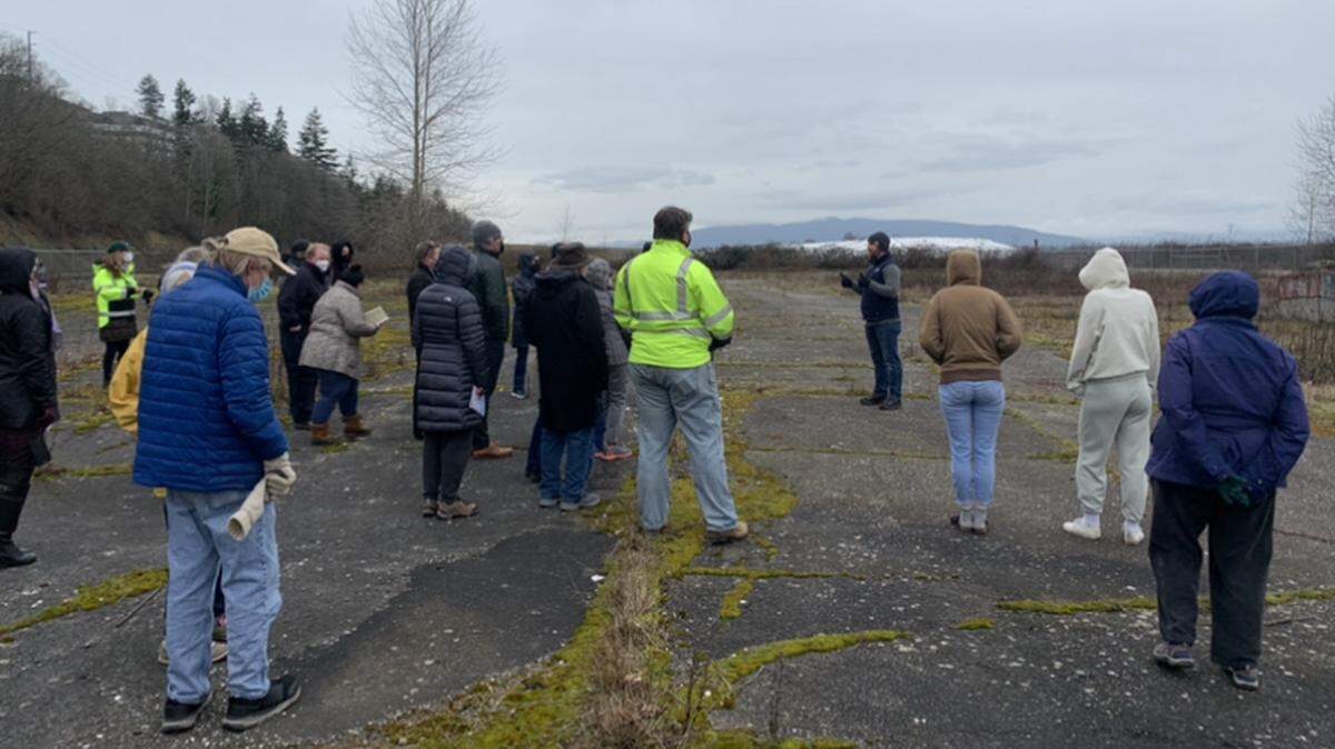 More than 20 community members attended a walking tour of the RG Haley clean-up site in Bellingham in 2022. Salish Landing is the name the city selected for the park planned for the site.