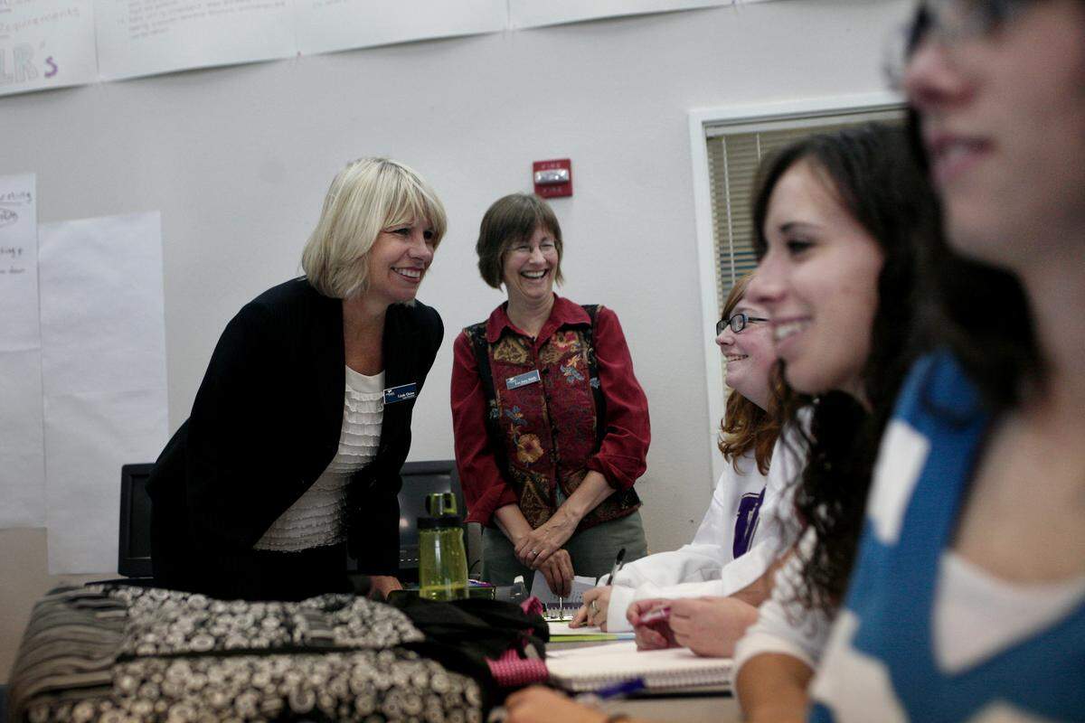 Ferndale Schools Superintendent Linda Quinn, left, talks with school officials and students at Windward High School in September  2009.