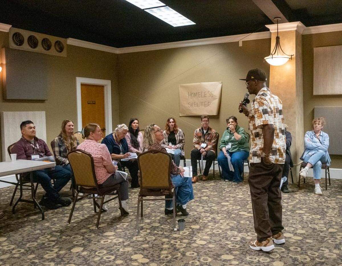 Up From Slavery Initiative founder and executive director Darryl Riley spoke to reentry simulation participants in the “homeless shelter” at the All Hands Whatcom summit.
