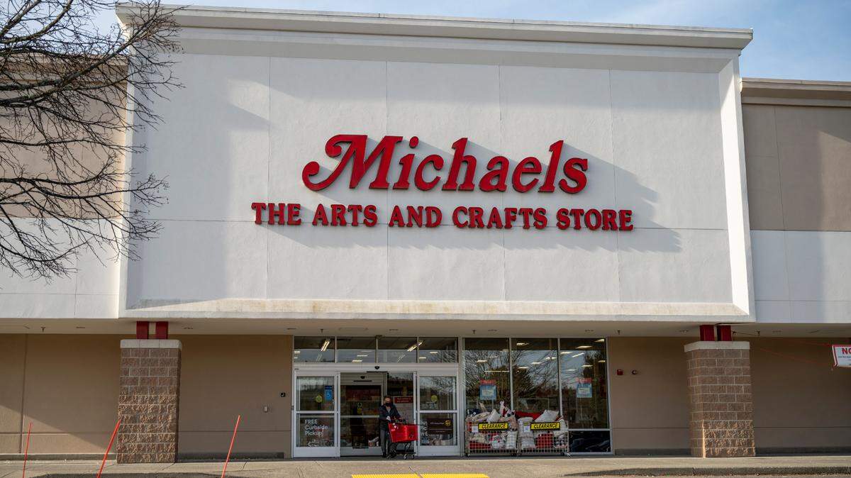 A shopper leaves Michaels Arts and Crafts Store at 4383 Meridian St. on Friday, Jan. 28, in Bellingham. It reopened Friday after it was closed for smoke damage after a fire in October 2021.