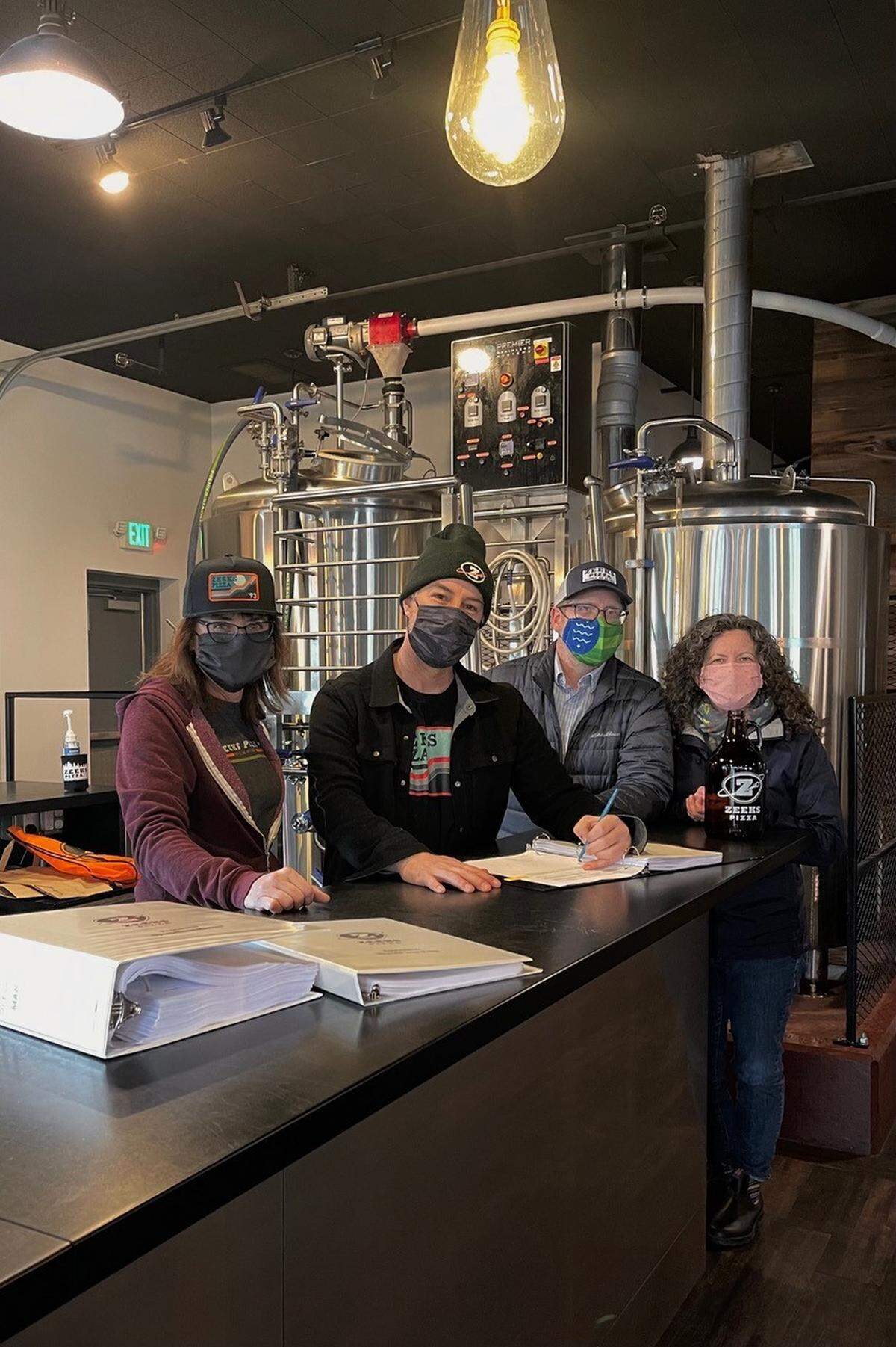 Julie Stotts, left, Matt Stotts, Brady Scott and Cindy Scott plan to open a Zeeks Pizza, in Bellingham’s Fountain District in the late spring or early summer at 2416 Meridian St., in the former home of 122 West Brewing and, earlier, Melvin Brewing.