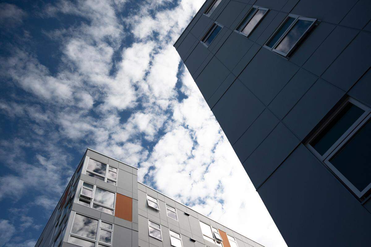 Clouds reflect off the windows of the recently constructed Stateside building on Tuesday, Sept. 21, in Bellingham.