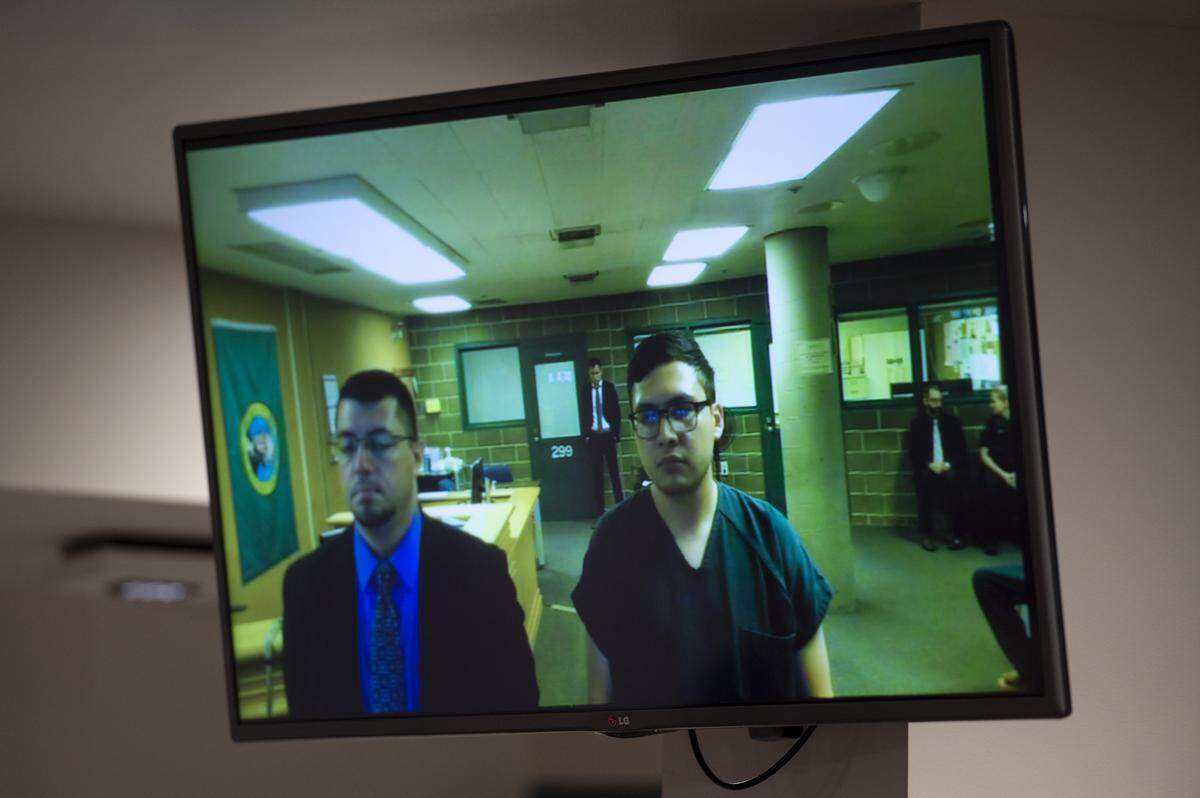 Rigoberto Galvan, 22, of Burlington, right, appears with defense attorney Adrian Madrone in Whatcom County Superior Court Wednesday. He was arrested earlier in the day for suspicion of first-degree murder. He allegedly climbed into an apartment through a window and shot a female victim.