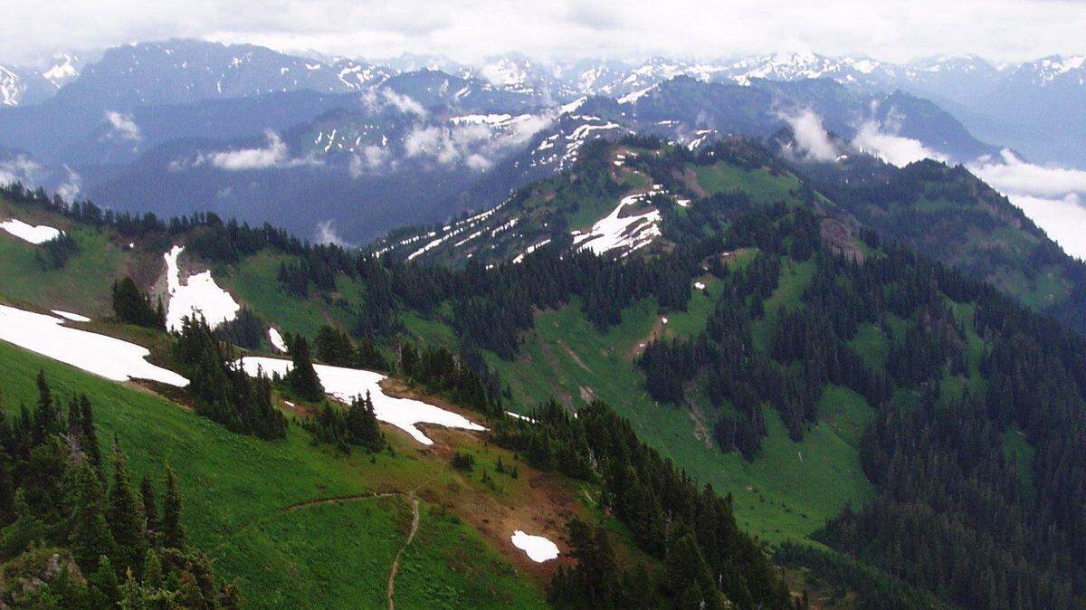 A 47-year-old man reportedly spent more than 24 hours in the Whatcom County wilderness after injuring his leg on a snowfield on Church Mountain.