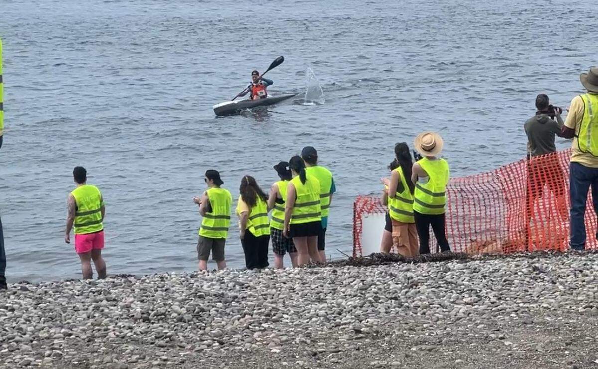 Jamie Klein of the Inn at Lynden team paddles to the beach at Marine Park in Bellingham to finish third in the 52nd Ski to Sea race on Sunday, May 25.