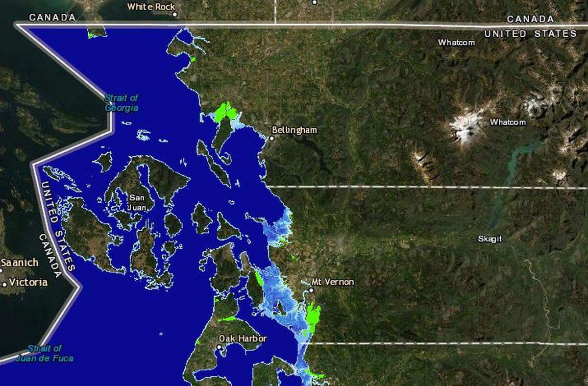 A NOAA online visualization shows the impacts of a 3-foot sea-level rise for Whatcom and Skagit counties. Water depth is shown in blue and green denotes low-lying areas.