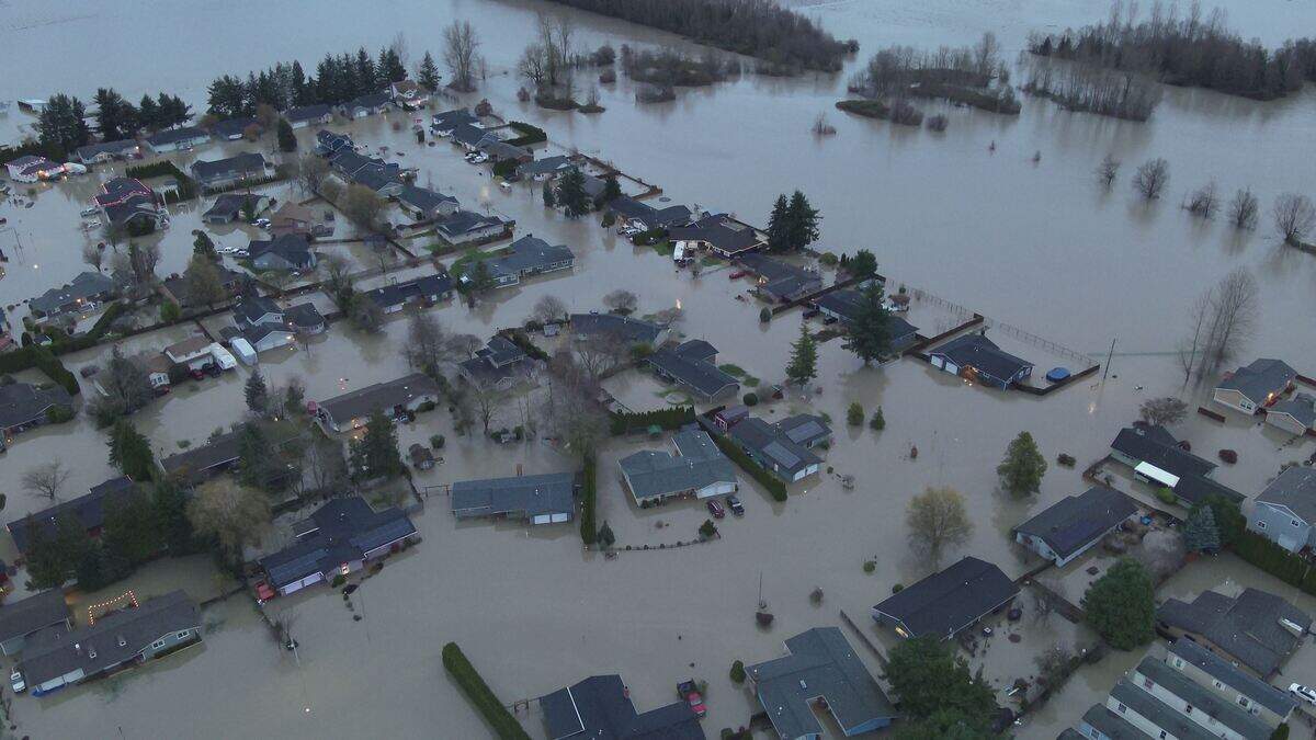 An aerial photo shows widespread flooding impacting a residential neighborhood after the Nooksack River overtopped its banks on Dec. 11, in Everson, Wash.