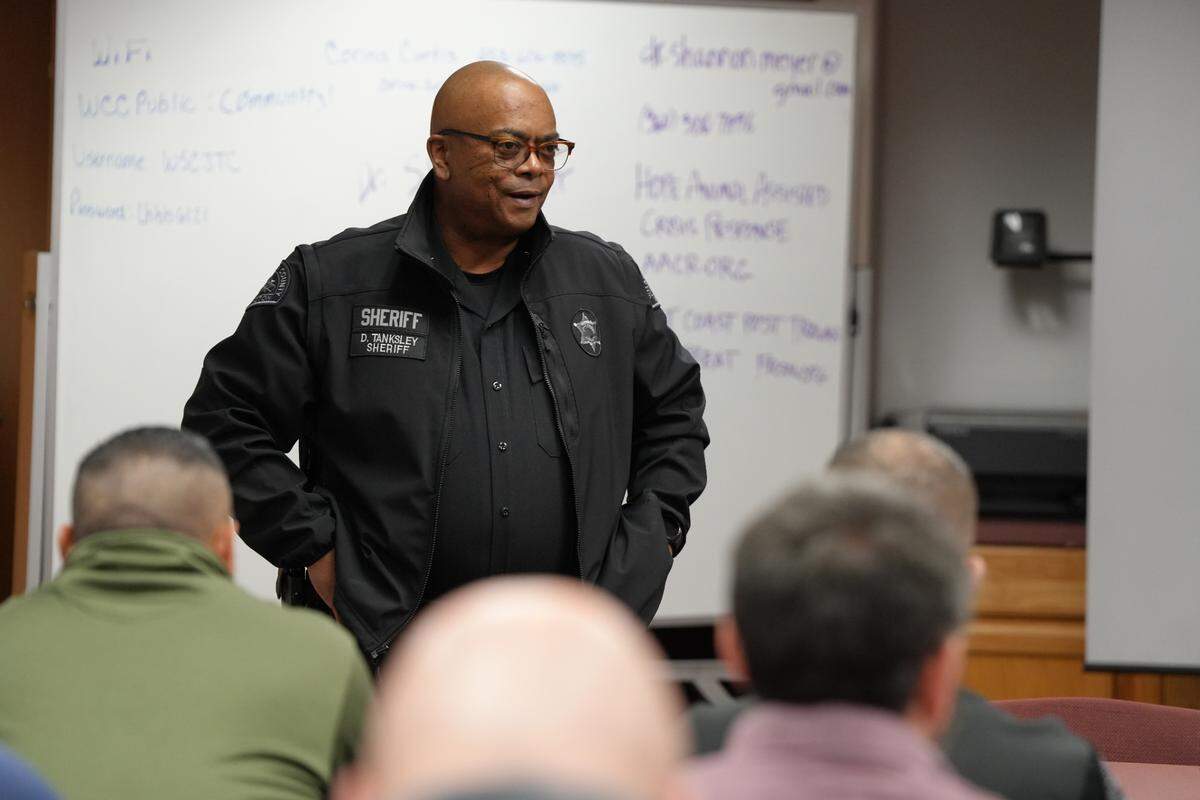 Whatcom County Sheriff Donnell Tanksley addresses law enforcement officers at a Crisis Intervention Training at Whatcom Community College in December.
