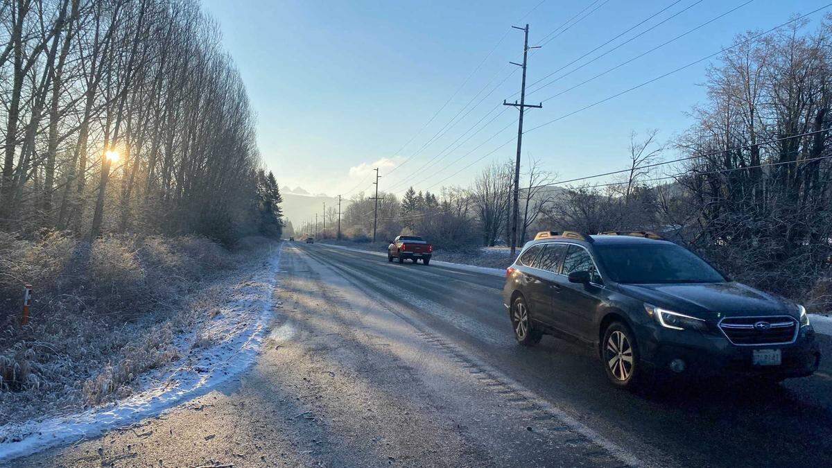 The sun rises on a snowy Whatcom County morning Thursday, Feb. 24, on Mount Baker Highway.