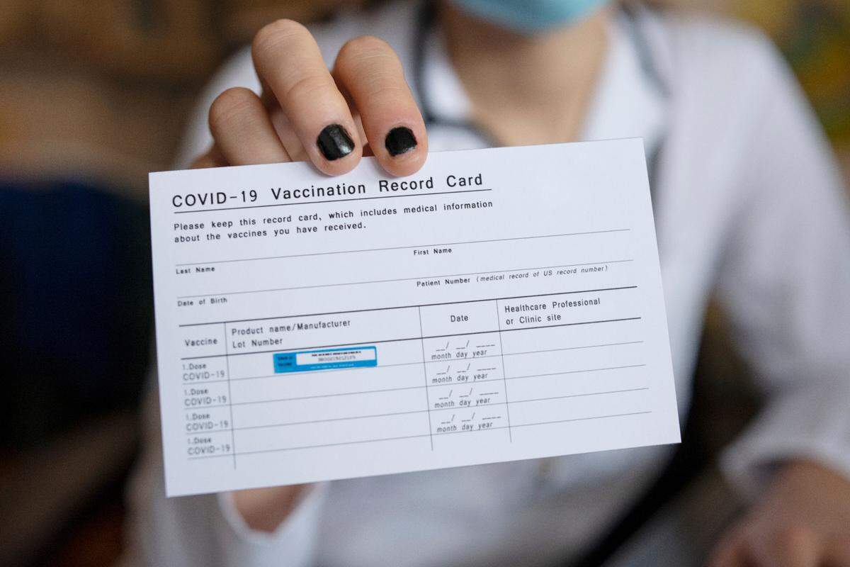 Close up of a COVID-19 Vaccination record card.