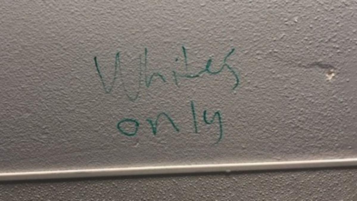 Three white Blaine Middle School students were suspended this week after writing racist graffiti on a school bathroom wall while two black students were in the stalls on March 26, 2019, police say.