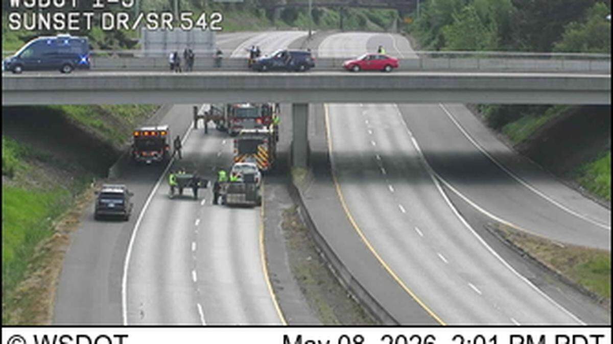Emergency vehicles can be seen responding to an incident on Interstate 5 at Sunset Drive Friday afternoon.