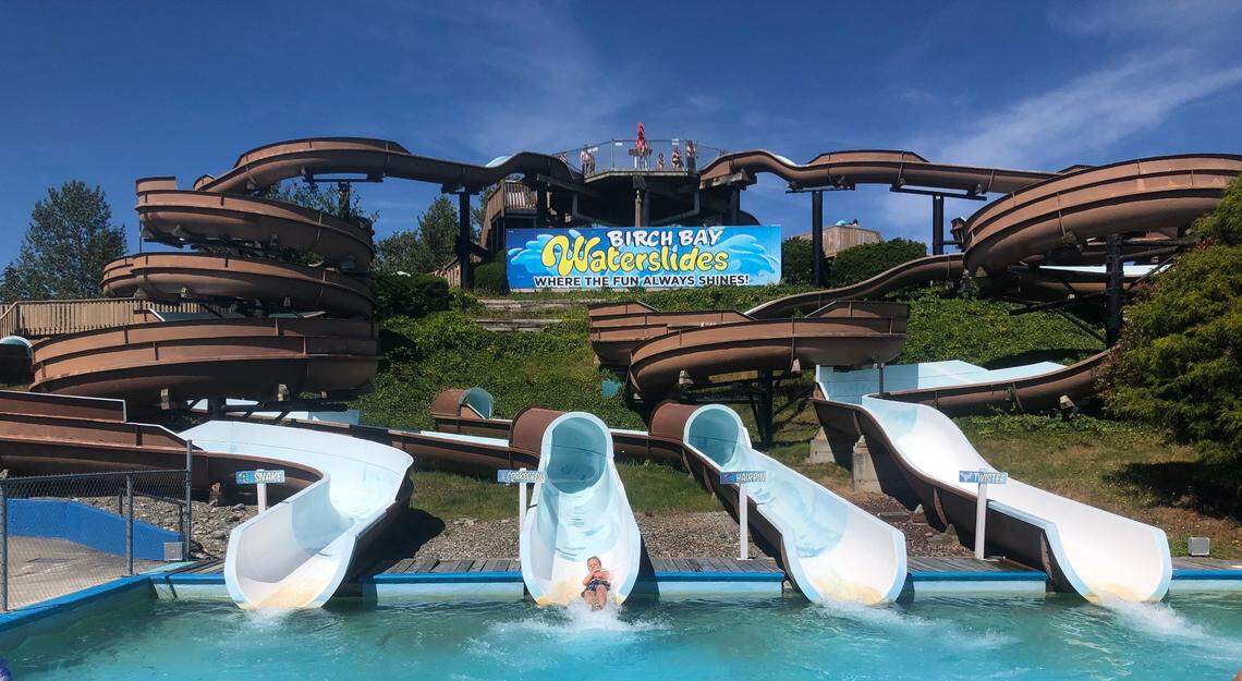 The Snake, left, Corkscrew, Hairpin and Twister water slides drop riders into a pool at Birch Bay Waterslides.