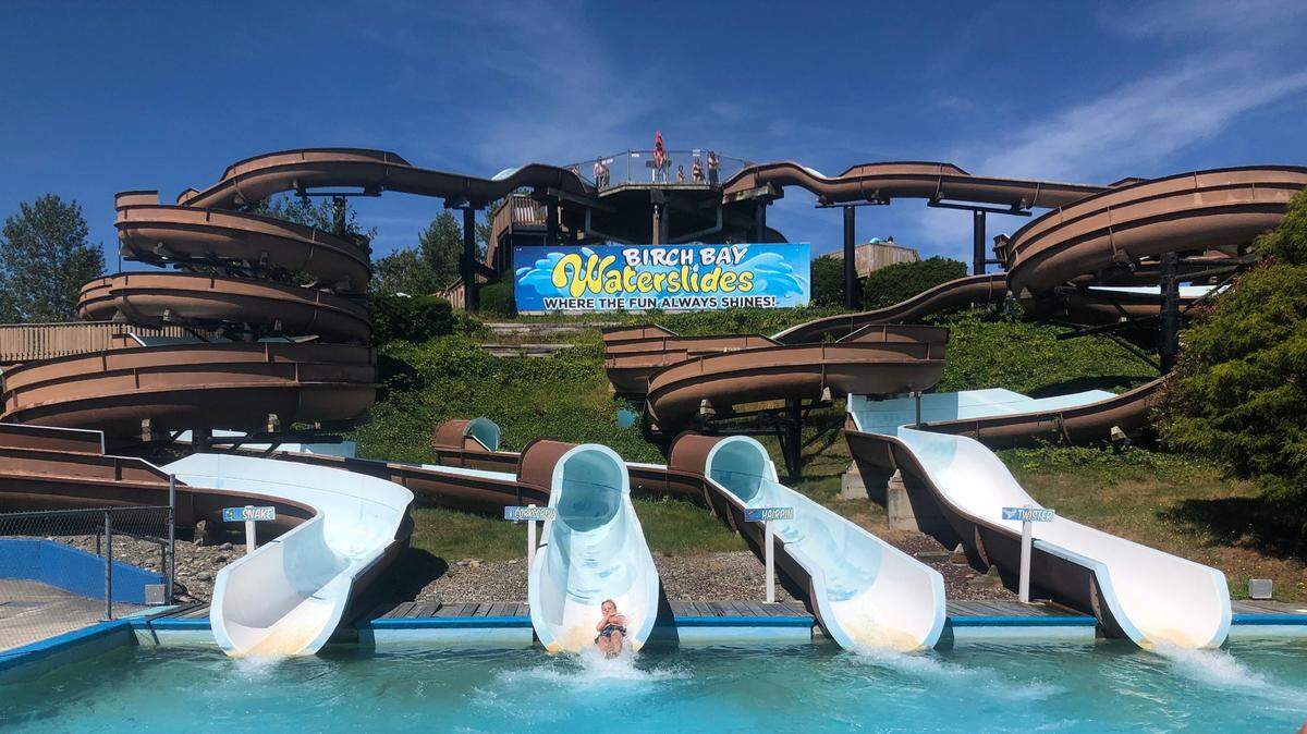 The Snake, left, Corkscrew, Hairpin and Twister water slides drop riders into a pool at Birch Bay Waterslides in 2022.