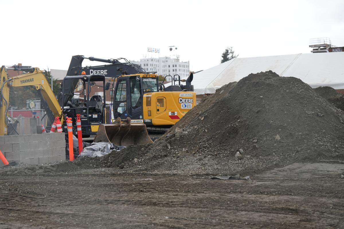 Construction is underway on October 8, 2024, to support a larger restroom, a new power source for food trucks, and additional lighting at the Portal Container Village in Bellingham, Wash.