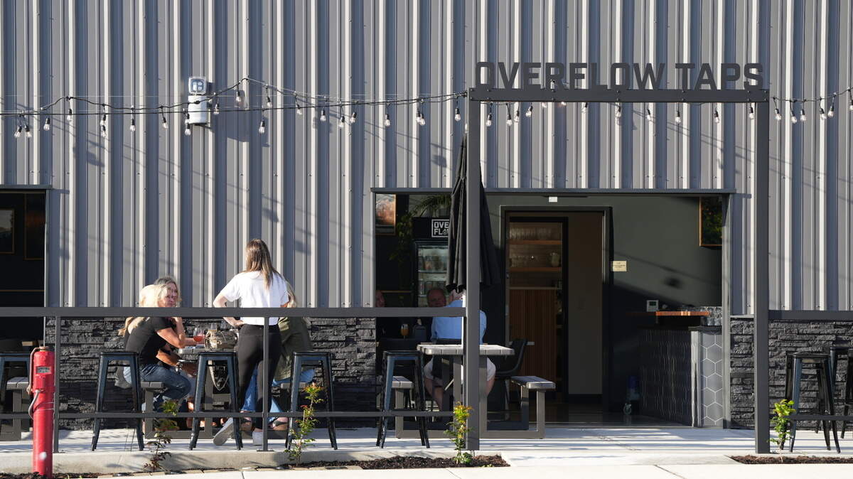Customers enjoy drinks at Overflow Taps’ newest location on September 16, 2024, in Lynden, Wash.