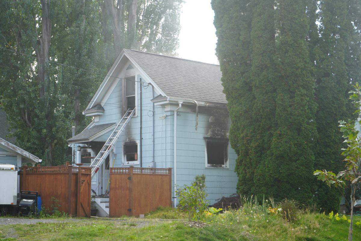 A residential home at 2230 Victor Street is visibly damaged after it caught fire on September 27, 2024, in Bellingham, Wash.