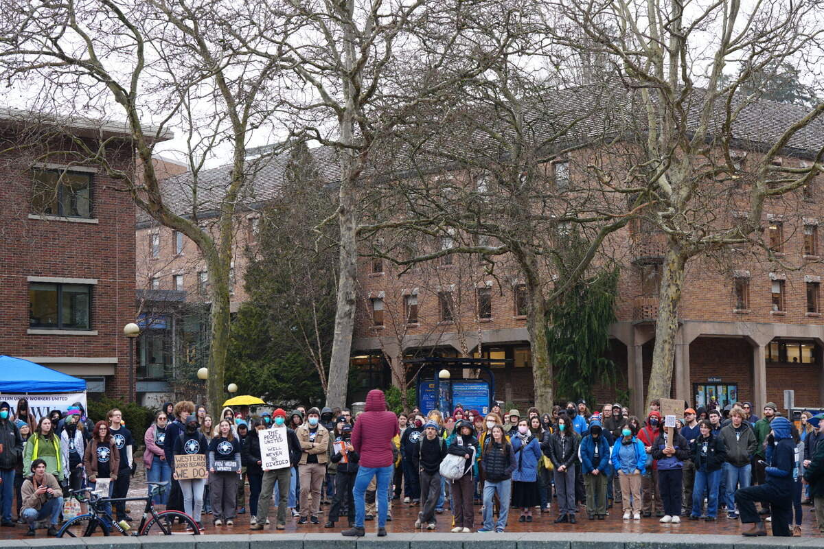 A crowd of more than 100 students and staff gathered at Western Washington University on Feb. 21, 2025, to protest proposed budget cuts to the University in Bellingham.