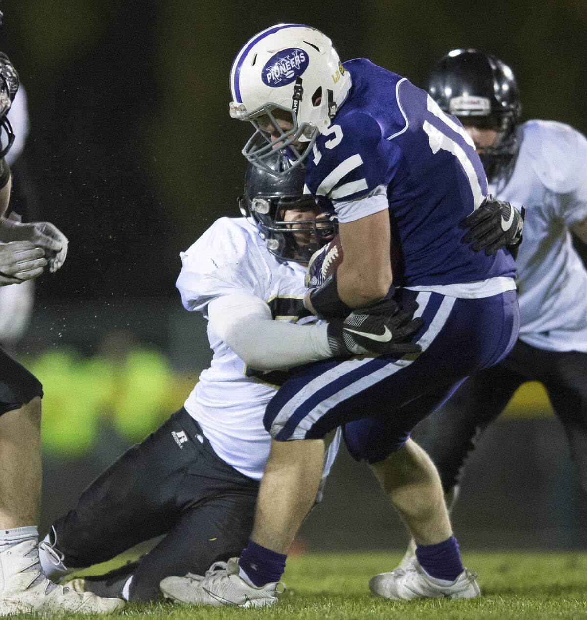 Meridian’s Manny Sabalza, left, stops Nooksack Valley’s Austin O’Bryan in a 2017 game. O’Bryan took an unusual route to becoming the starting quarterback for the Pioneers and has produced some memorable moments as they prepare for NWC 1A play.