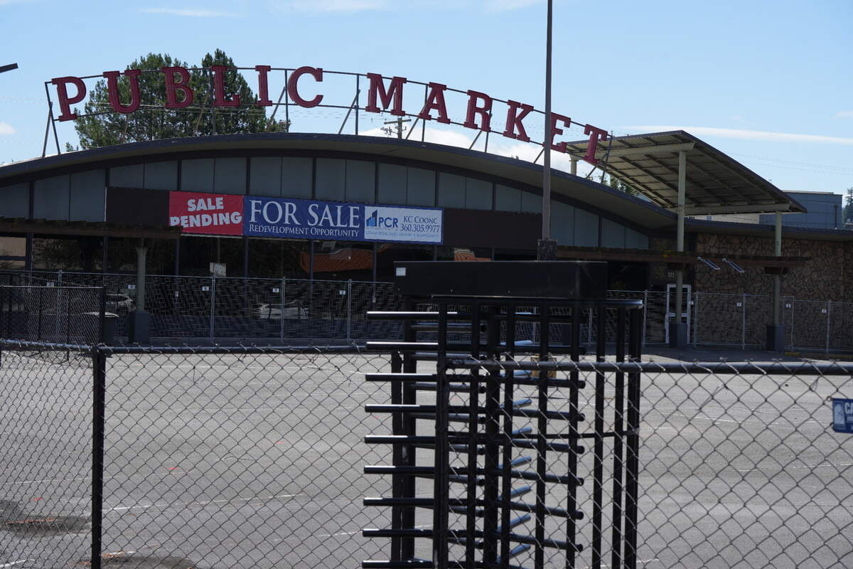 A “Sale Pending” sign is posted on the former Public Market building on July 3 in Bellingham. The Whatcom Transportation Authority plans to buy the property and turn it into a new transit station.