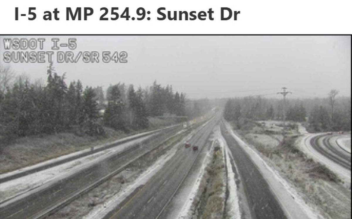 Snow began accumulating in Bellingham with the first snowfall of the winter season on Saturday, as shown on a traffic camera on Interstate 5 at Sunset Drive.