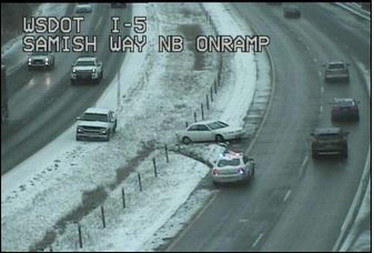 A car rests in the median on Interstate 5 northbound at Samish Way, where the Washington State Department of Transportation reported a collision blocking the left lane about 3:30 p.m. Sunday in Bellingham.
