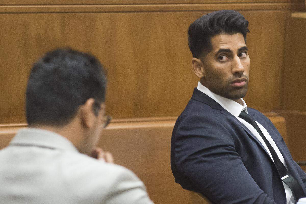 Former Bellingham Police officer Sukhdev Dhaliwal, right, and his brother Jagmeet Dhaliwal appear in Whatcom County Superior Court on the first day of their assault trial in Bellingham.