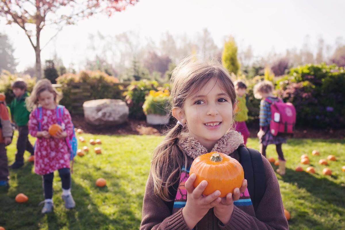 Lucy Guerra holds a pumpkin in an undated family photo.