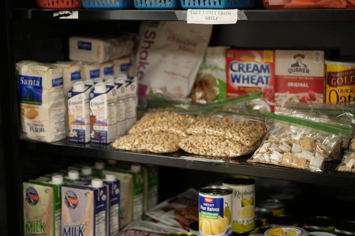 The food pantry at the Woodrose Senior Affordable Apartments in Bellingham offers a selection of dry goods for residents to select from, including bagged cereal, canned goods and shelf-stable milk.