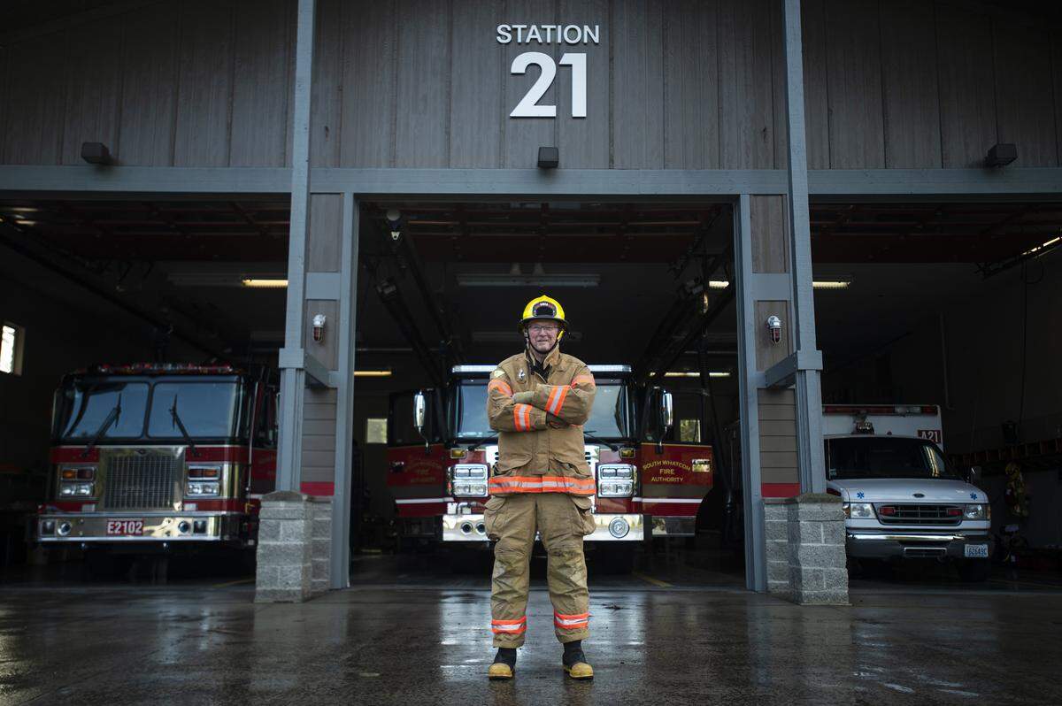 Firefighter Ron Swanson, 82, stands for a portrait in his turnout gear outside of South Whatcom Fire Station 21 in the Geneva area of Bellingham, Wash., on Jan. 10, 2019. Swanson has been a firefighter at Station 21 for more than 51 years.
