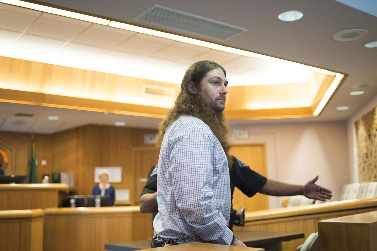Sheaen Emmette Smith exits the courtroom after pleading not guilty by reason of insanity on Monday in Whatcom County Superior Court in Bellingham. Smith was accused of second-degree murder for the stabbing death of his mother in their Fairhaven home in March 2017.
