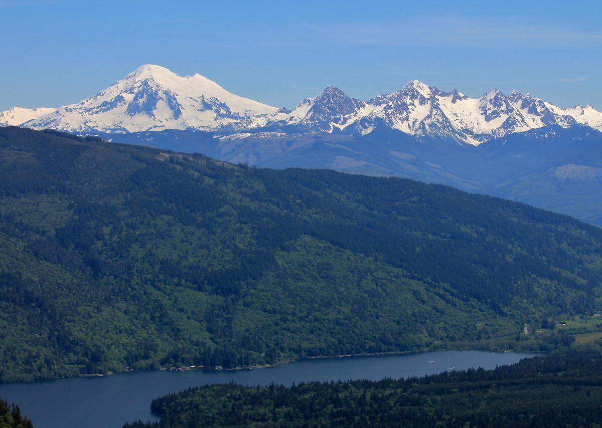 Mount Baker and Twin Sister Range with the Stewart Mountain and Lake Whatcom South Bay in the foreground in 2017. Climate change could contribute to a significant reduction in dissolved oxygen in the lake, which could increase the cost of treatment for a major source of drinking water in the county.
