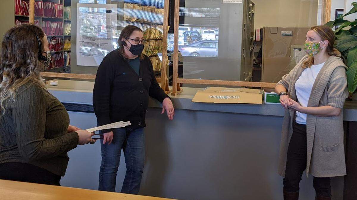 Whatcom County Health Department Director Erika Lautenbach, right, speaks with clerks at the department in March. Last week Councilwoman Kathy Kershner criticized Lautenbach on social media about COVID, triggering a Sheriff’s Office report because of threats made to the employee.