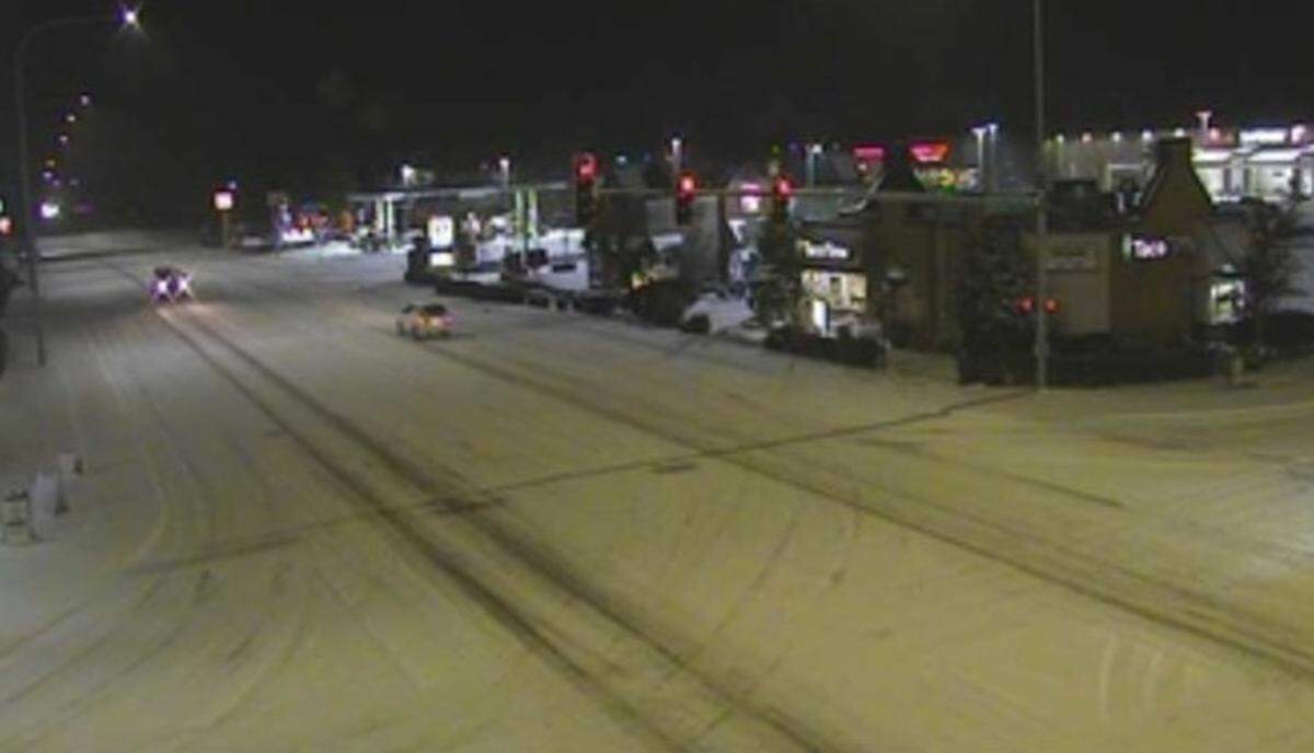 A Washington State Department of Transportation camera shows a snowy scene early Monday at Guide Meridian and Birch Bay-Lynden Road.