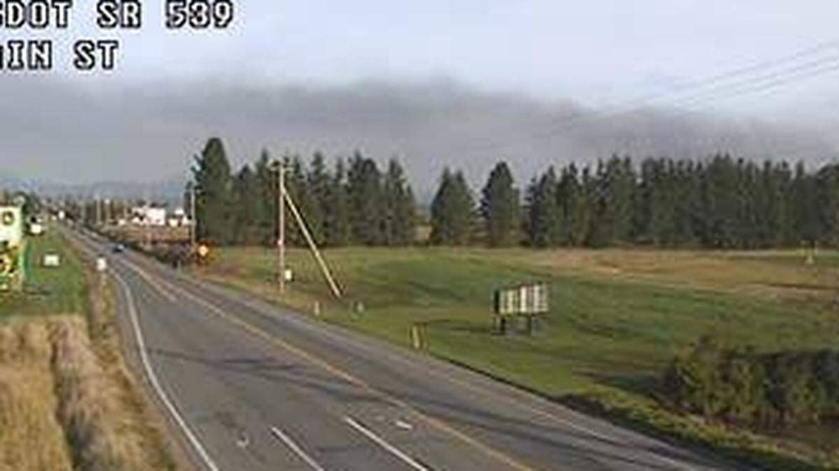Heavy, black smoke from 100 recreational vehicles burning at an Abbotsford, B.C., RV center is visible south of the U.S.-Canada border in Whatcom County Wednesday, Nov. 17.