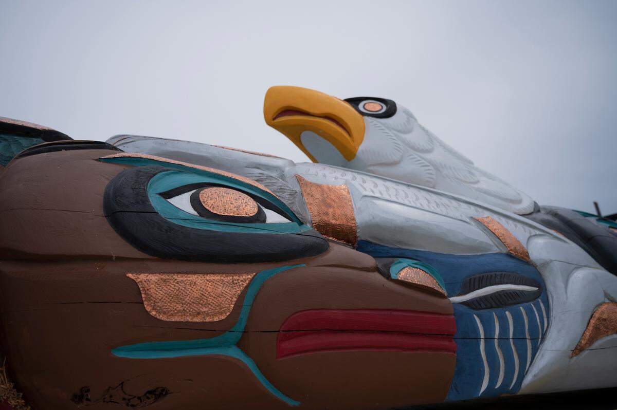 Jewell James’ totem pole, on display Wednesday, May 5, in Ferndale includes eagles, wolves, salmon and human spirits.