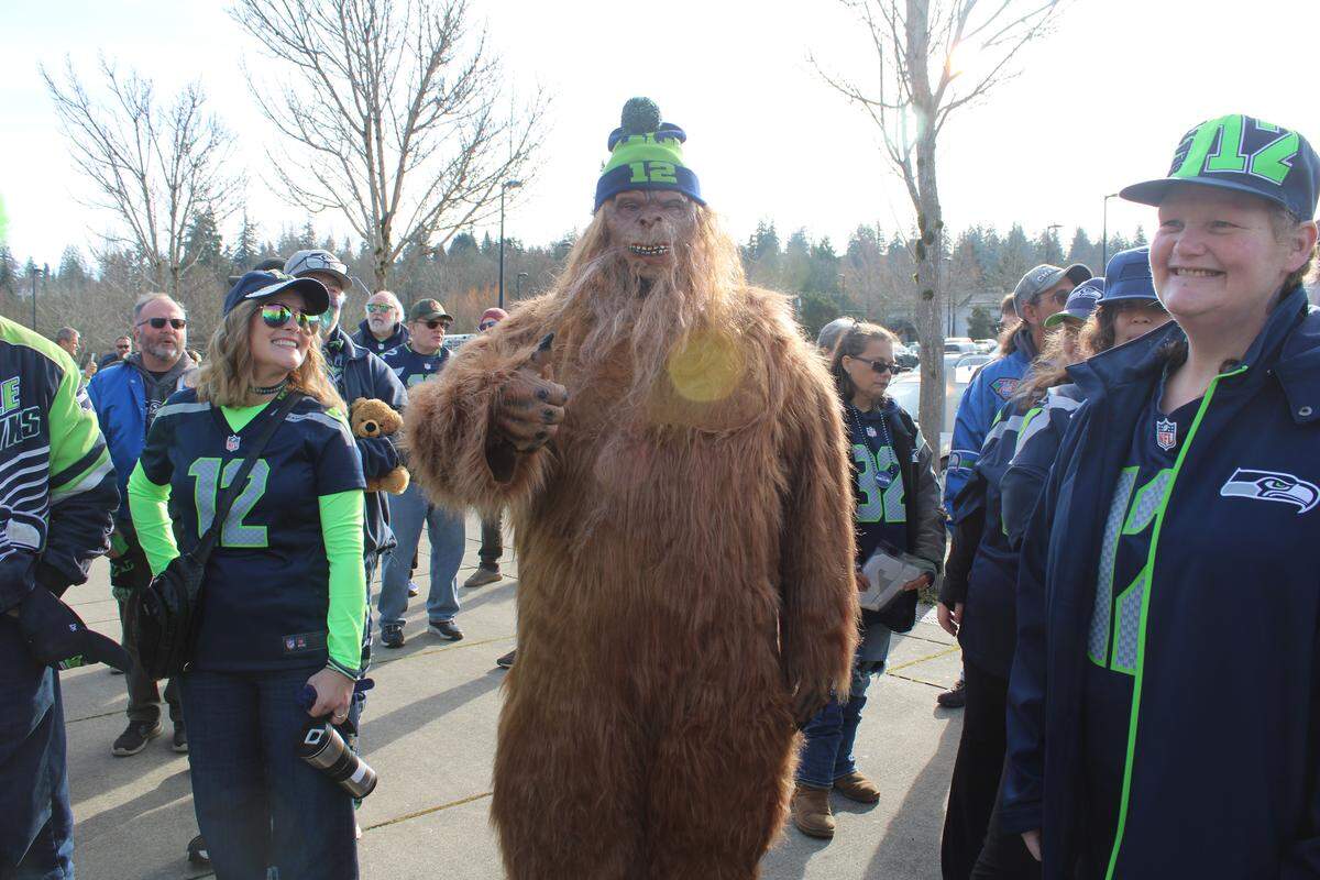 Dante Redlightning, dressed as Sasquatch, poses for photos at Civic Stadium on Friday, Feb. 6, 2026 in Bellingham.